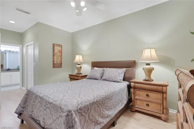 a bedroom with a bed and a lamp