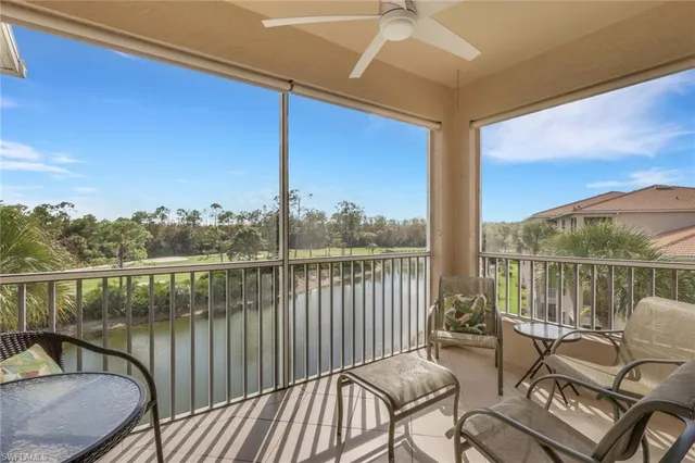a balcony with table and chairs
