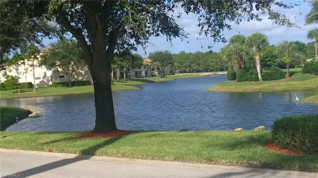 a front view of a house with a yard table and chairs