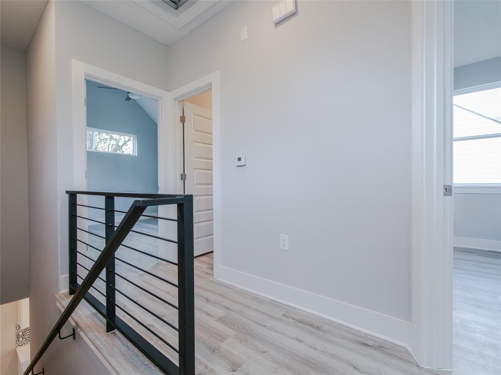 1042 Rosemont Street, Unit 2 Austin, TX 78723 - Photo 14 of 22 a view of entryway with a window and wooden floor