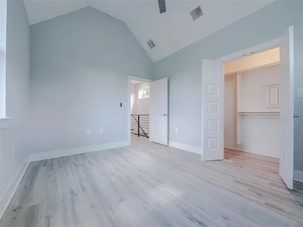 a view of an empty room and wooden floor