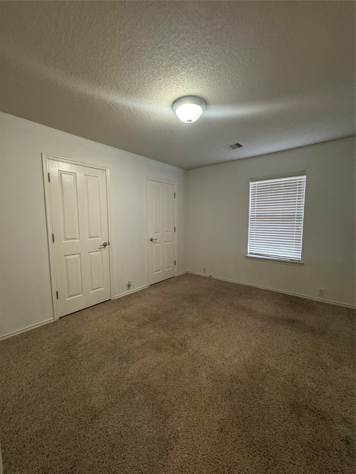 13600 Breton Ridge Street, Unit 36C Houston, TX 77070 - Photo 14 of 40 a view of an empty room and a window