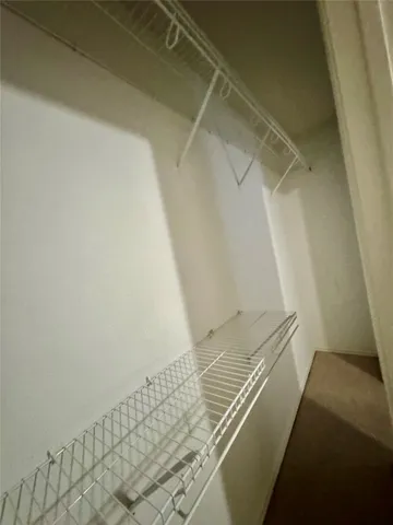 a view of a room with racks on the wall