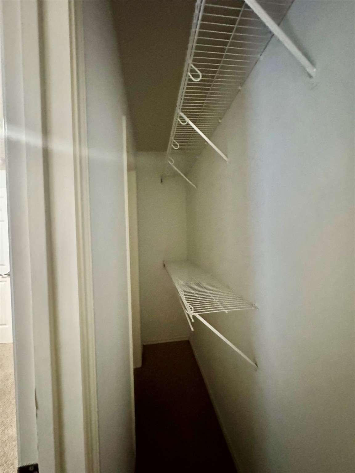 13600 Breton Ridge Street, Unit 36C Houston, TX 77070 - Photo 17 of 40 a view of a room with racks on the wall