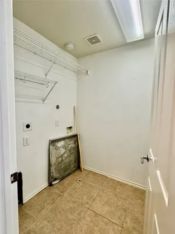 a bathroom with a sink a toilet and a large mirror