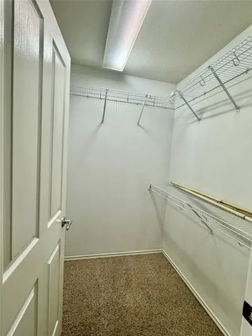 an empty room with a bathroom