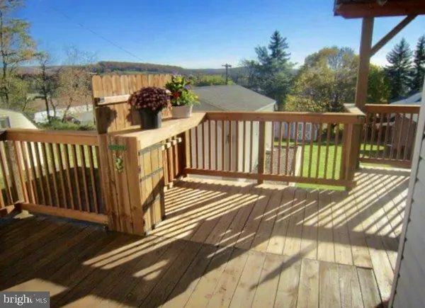 a view of a balcony with wooden floor