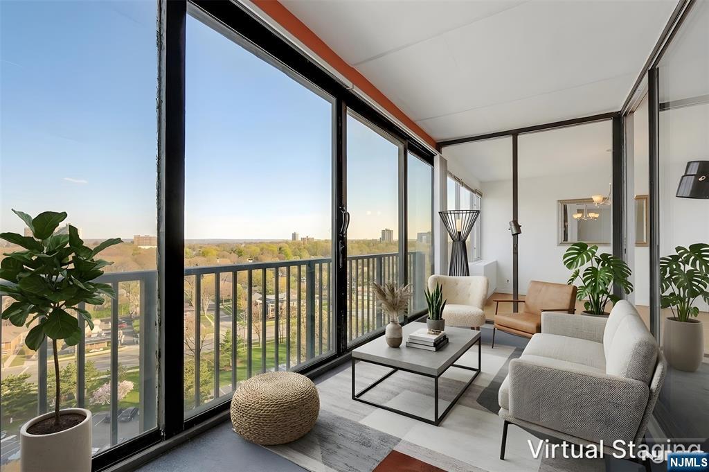 6 Horizon Road, Unit 1508 Fort Lee, NJ 07024 - Photo 2 of 46 a living room with furniture and a potted plant