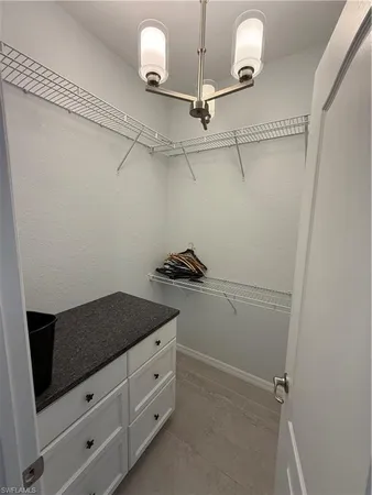 a view of a storage and utility room with closet