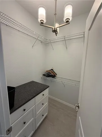 a view of a storage and utility room with closet