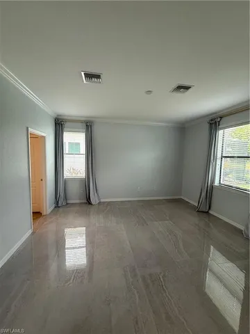 an empty room with windows