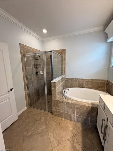 a bathroom with a bathtub and shower
