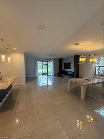 a large living room with a large window