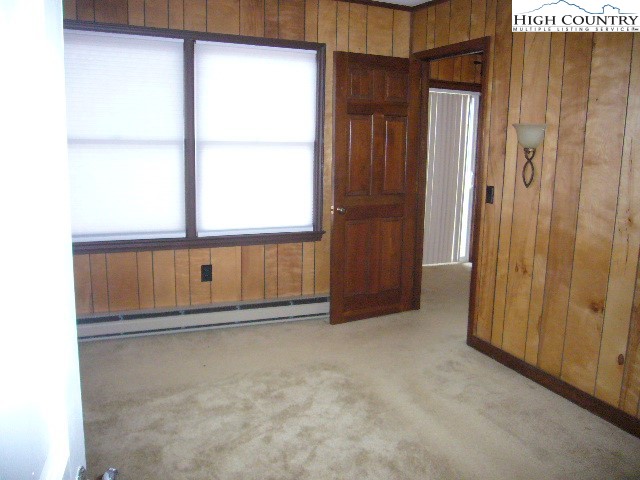 726 Pine Ridge Road Beech Mountain, NC 28604 - Photo 11 of 19 a view of an empty room with a window