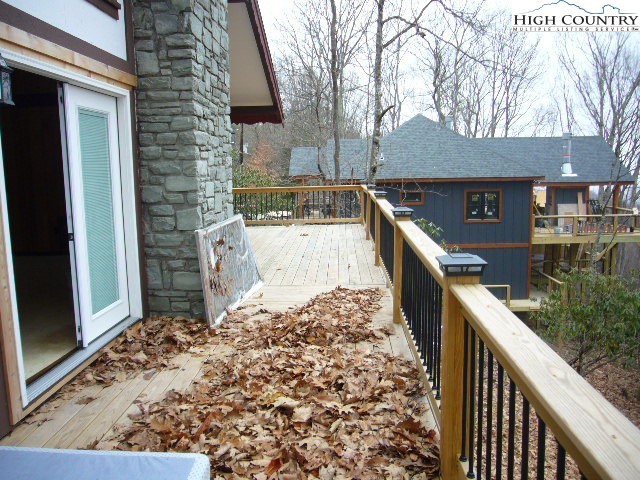 726 Pine Ridge Road Beech Mountain, NC 28604 - Photo 15 of 19 a view of a house with wooden fence