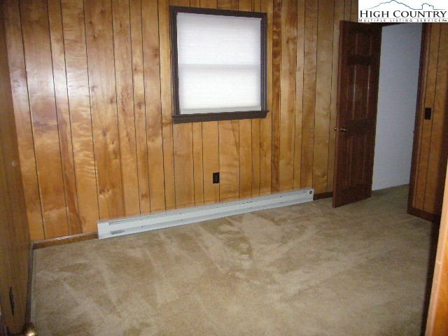 726 Pine Ridge Road Beech Mountain, NC 28604 - Photo 10 of 19 a view of an empty room with windows