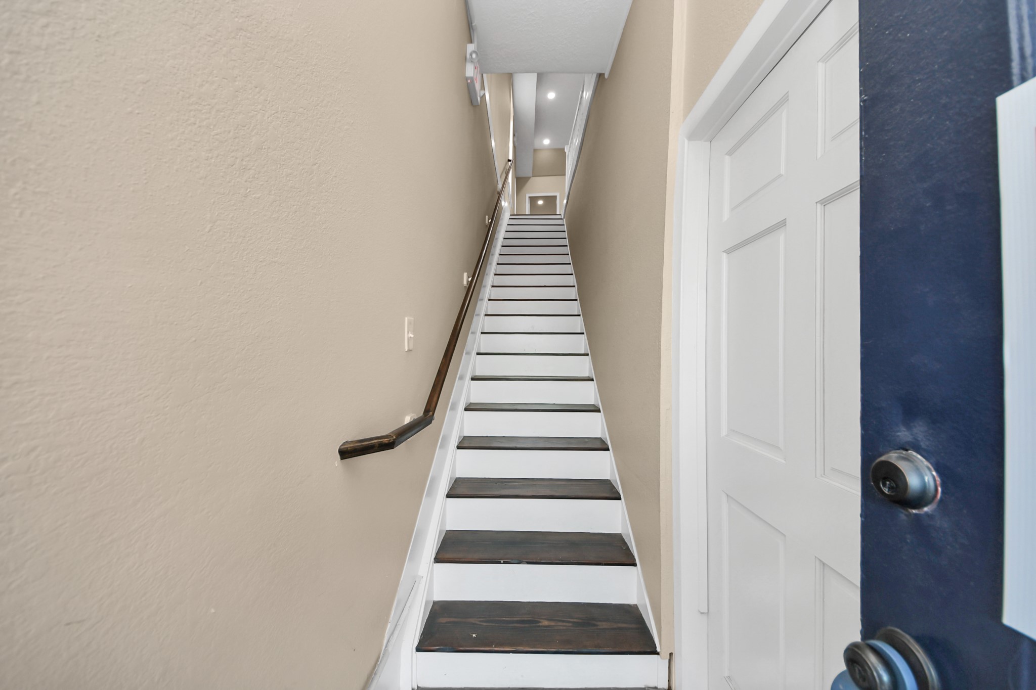 223 West Main Street, Unit 1/2 La Porte, TX 77571 - Photo 2 of 12 Private stair entry to this upper-level 2bedroom apartment, offering added privacy and a quiet living environment.