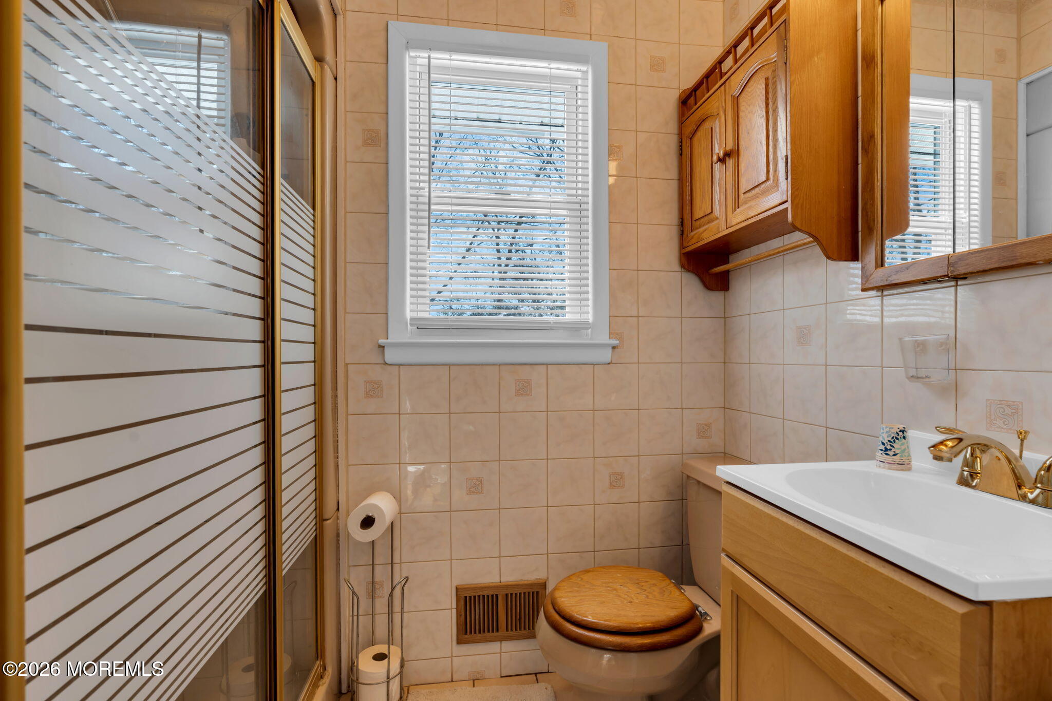 7 Klein Street Oakhurst, NJ 07755 - Photo 12 of 25 a bathroom with a sink a toilet and a mirror