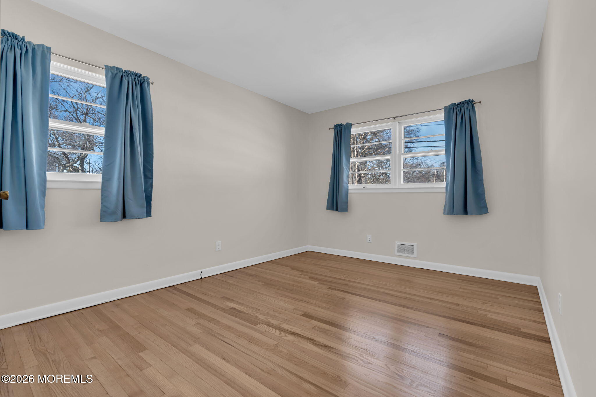 7 Klein Street Oakhurst, NJ 07755 - Photo 15 of 25 a view of an empty room with wooden floor and a window