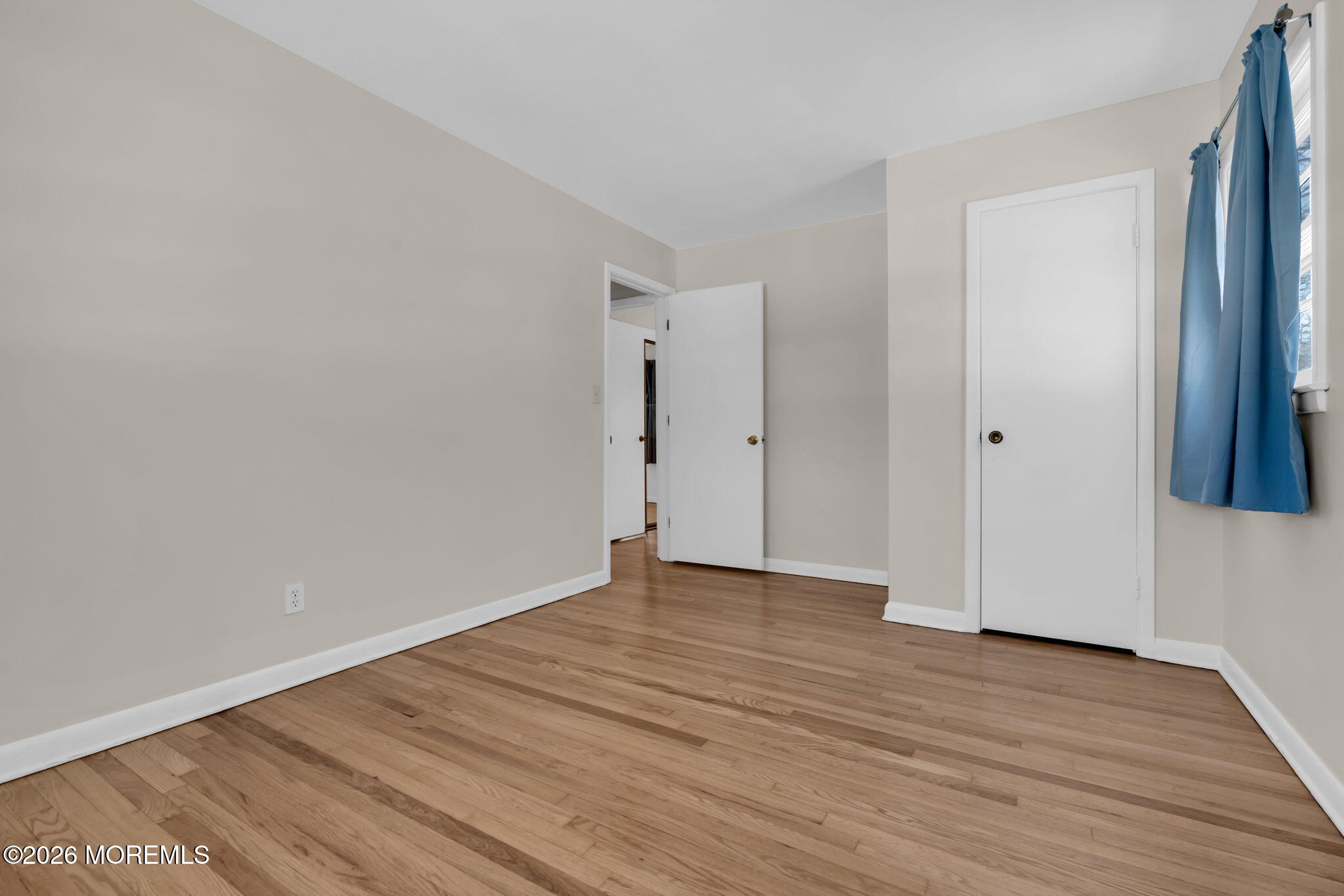 7 Klein Street Oakhurst, NJ 07755 - Photo 16 of 25 a view of an empty room with wooden floor and entryway