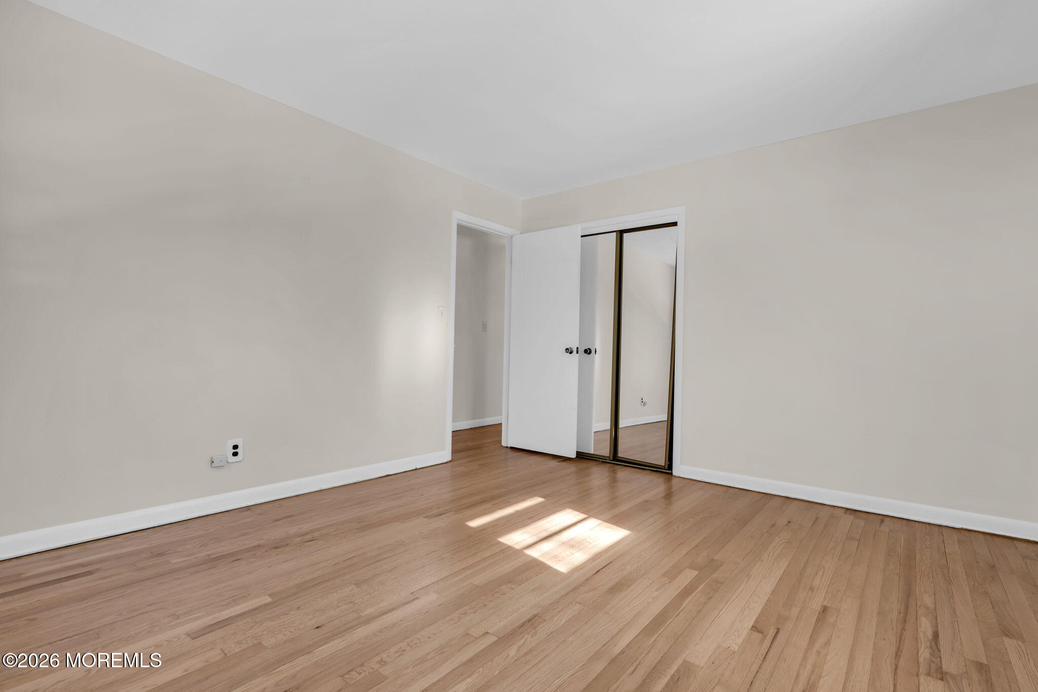 7 Klein Street Oakhurst, NJ 07755 - Photo 18 of 25 an empty room with wooden floor and windows