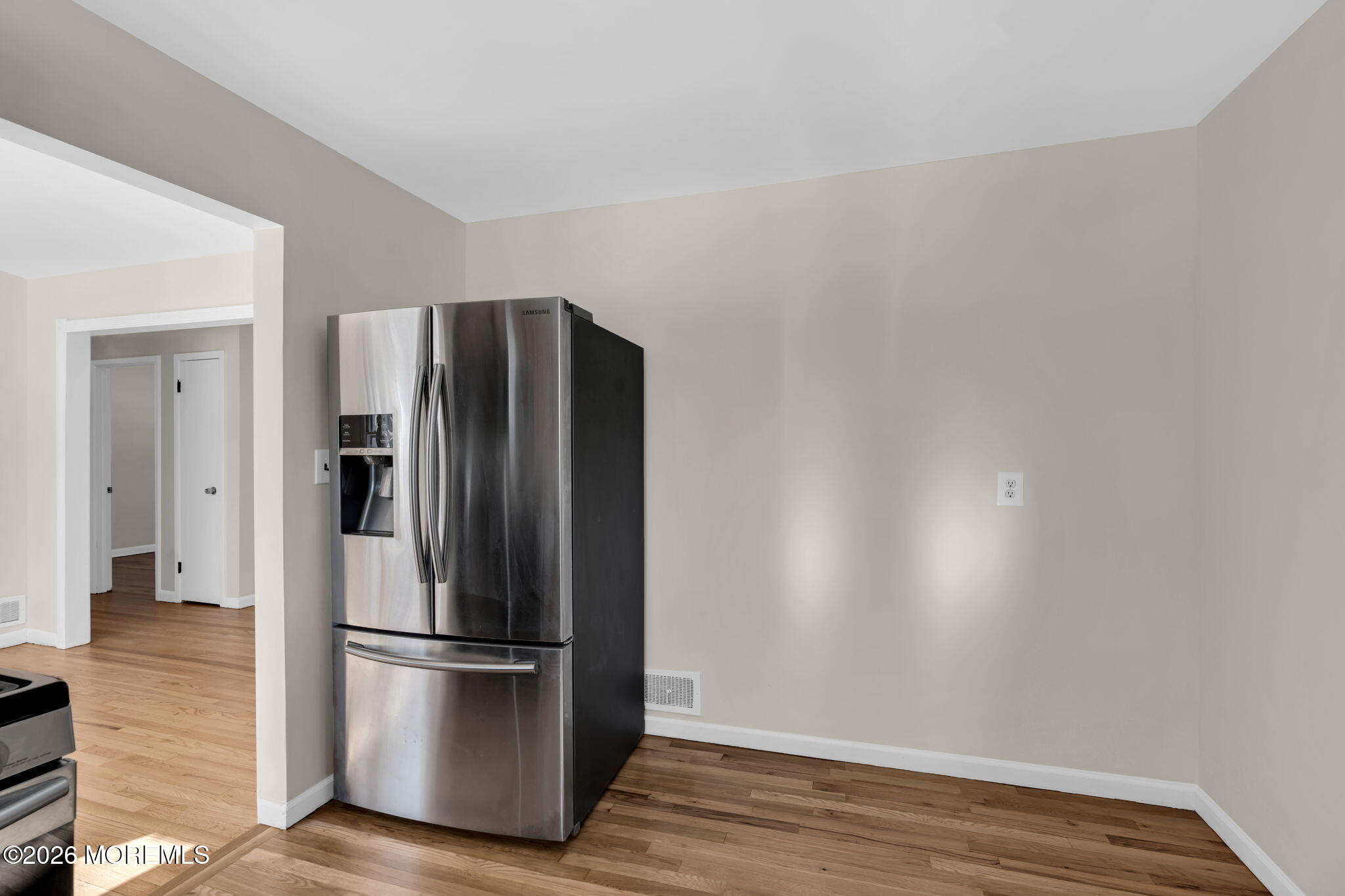 7 Klein Street Oakhurst, NJ 07755 - Photo 8 of 25 a metallic refrigerator freezer sitting in a kitchen