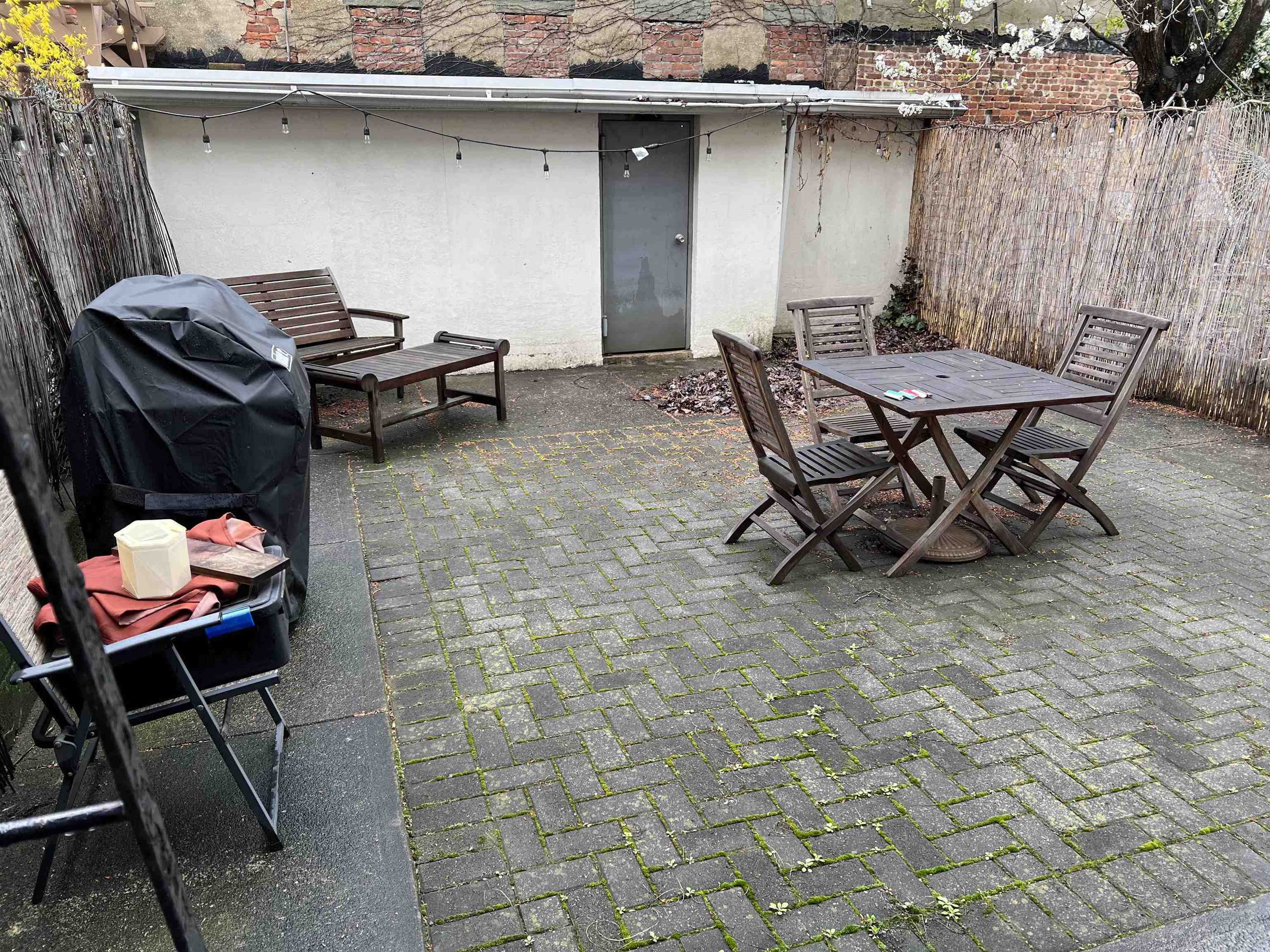 a patio with table and chairs