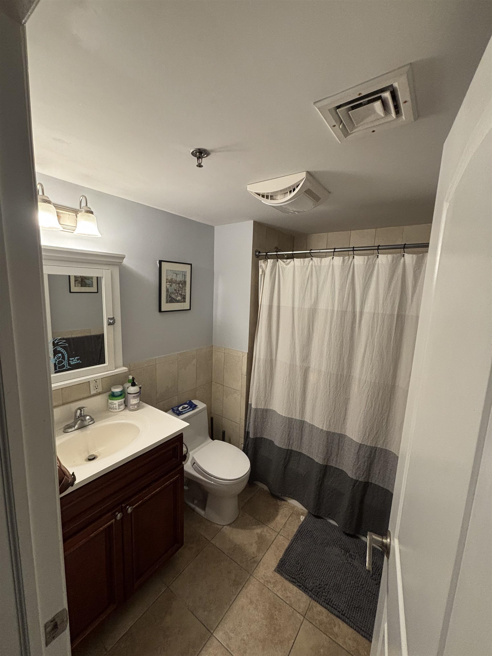 528 Garden Street, Unit B Hoboken, NJ 07030 - Photo 11 of 13 a spacious bathroom with a sink and a mirror