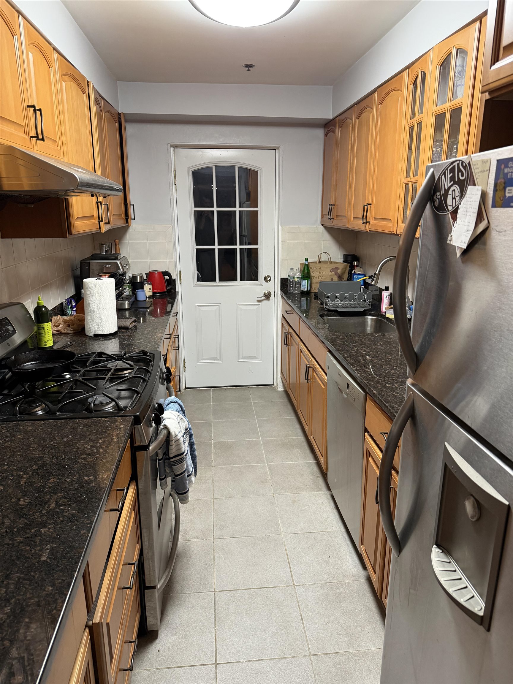 528 Garden Street, Unit B Hoboken, NJ 07030 - Photo 10 of 13 a kitchen with stainless steel appliances granite countertop a sink stove and cabinets
