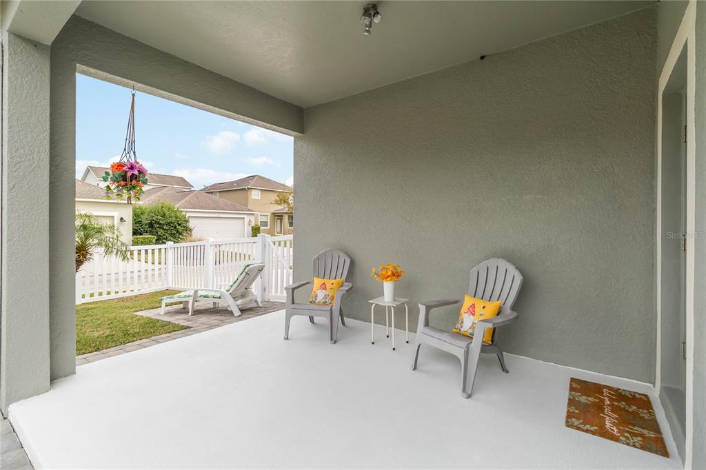 6805 Sundrop Street Harmony, FL 34773 - Photo 22 of 24 a view of a two chair in a patio
