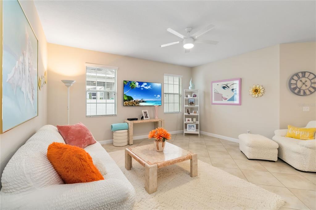 6805 Sundrop Street Harmony, FL 34773 - Photo 4 of 24 a living room with furniture and a couch