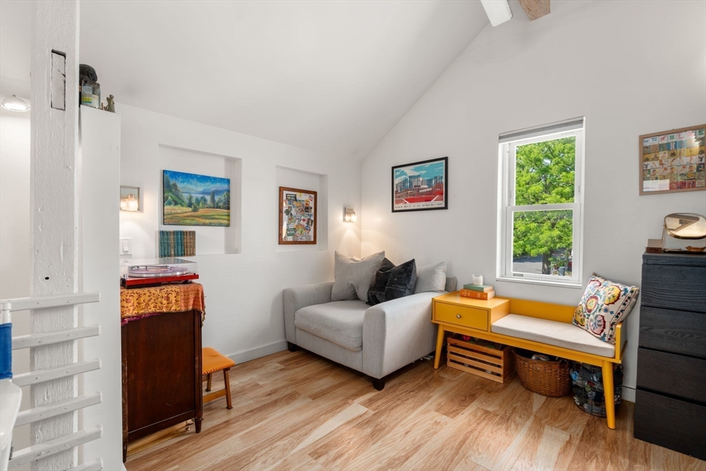 67 Dudley Street, Unit SF Boston, MA 02119 - Photo 6 of 28 a living room with furniture and a window