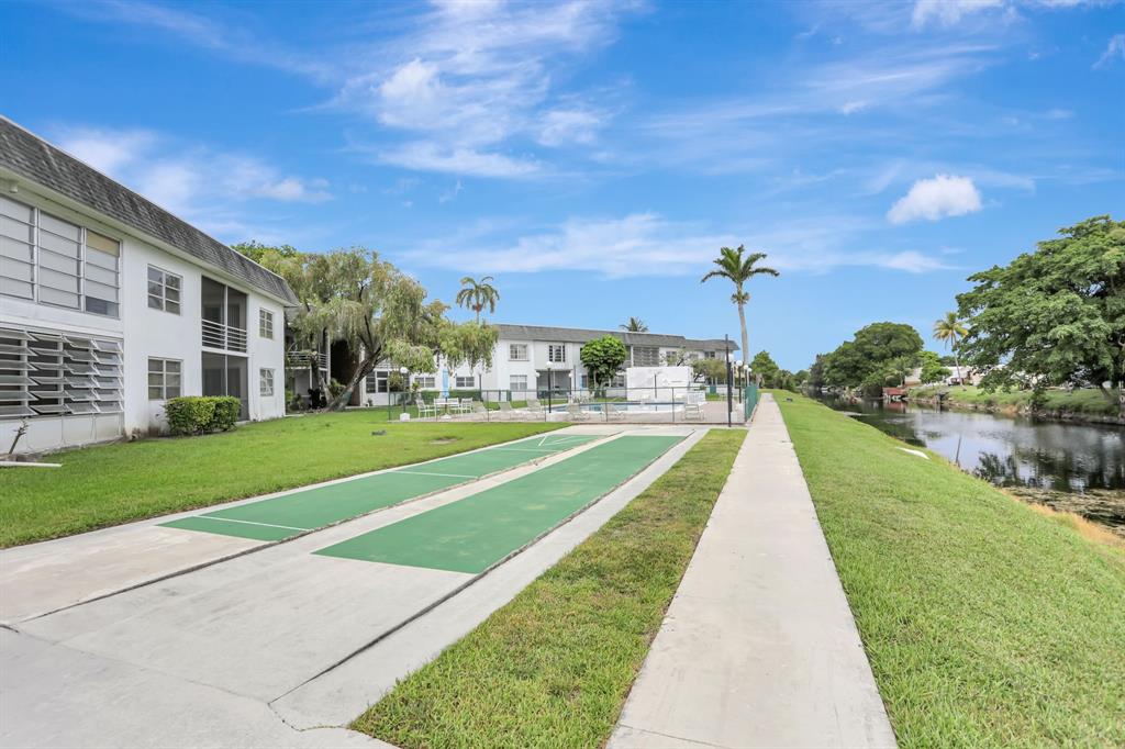 6503 Winfield Boulevard, Unit 107D Margate, FL 33063 - Photo 19 of 24 a view of a house with a yard