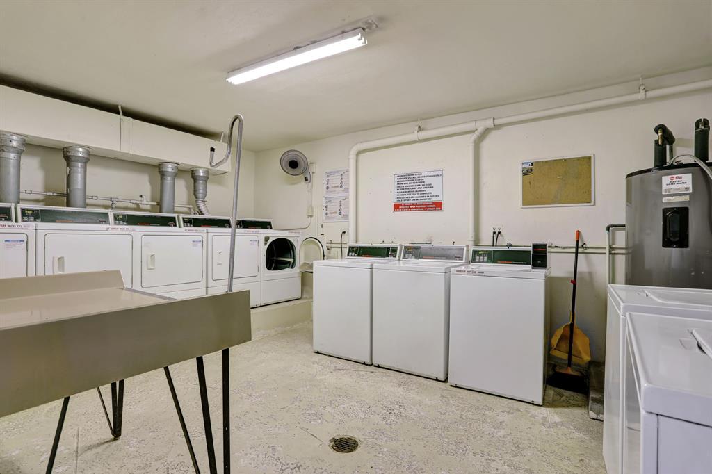 6503 Winfield Boulevard, Unit 107D Margate, FL 33063 - Photo 22 of 24 a kitchen with cabinets and chairs