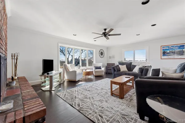 a living room with furniture or couch and a flat screen tv