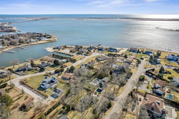an aerial view of a house with a ocean view