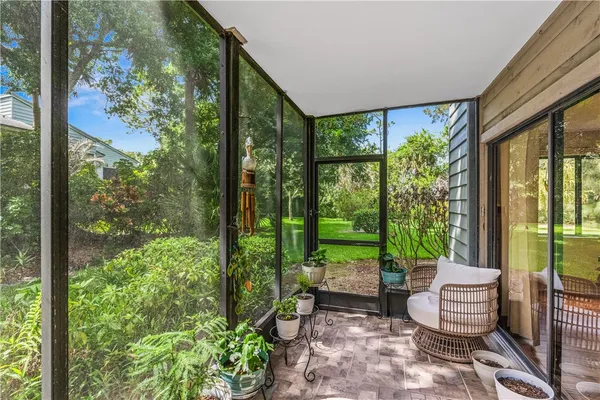 a living room with furniture and a garden