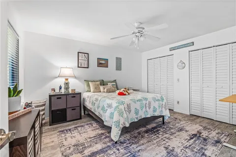 a bed room with a bed and a chandelier