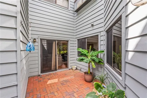 a potted plant sitting in front of a house