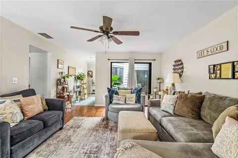 a living room with furniture and a large window