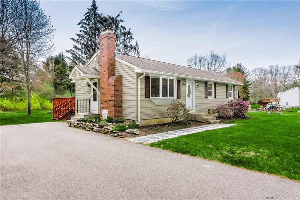 146 Daly Road Hebron, CT 06248 - Photo 1 of 1 a front view of a house with garden