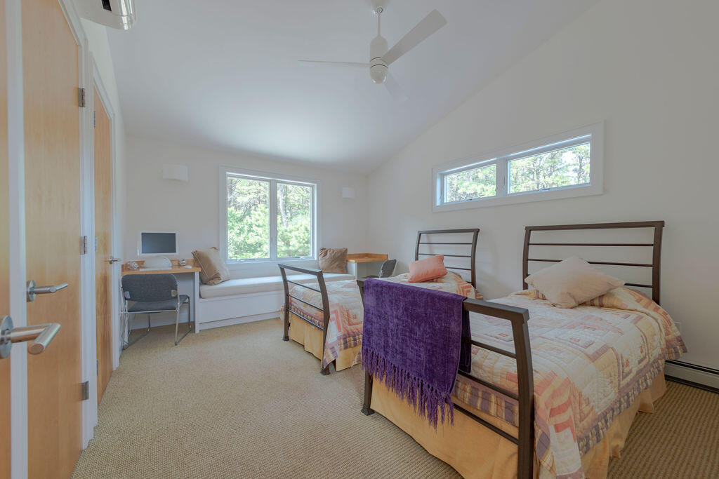 10 Hamblen Farm Road Wellfleet, MA 02667 - Photo 25 of 59 a bedroom with a bed and a couch