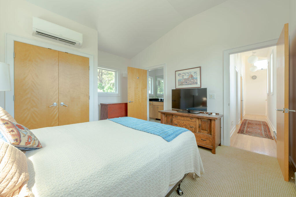 10 Hamblen Farm Road Wellfleet, MA 02667 - Photo 28 of 59 a bedroom with a bed and a flat screen tv