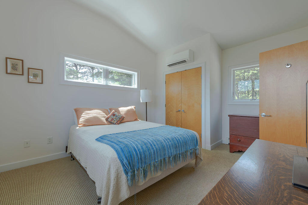 10 Hamblen Farm Road Wellfleet, MA 02667 - Photo 29 of 59 a bedroom with a bed and a table