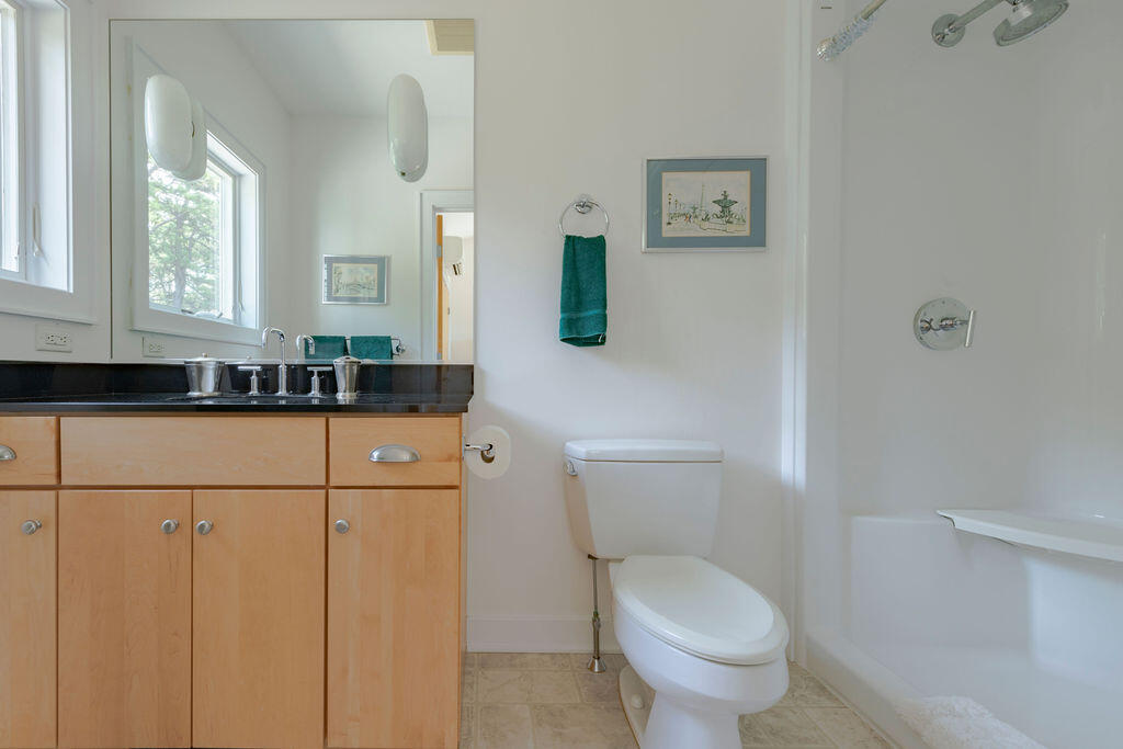 10 Hamblen Farm Road Wellfleet, MA 02667 - Photo 30 of 59 a bathroom with a toilet sink and mirror