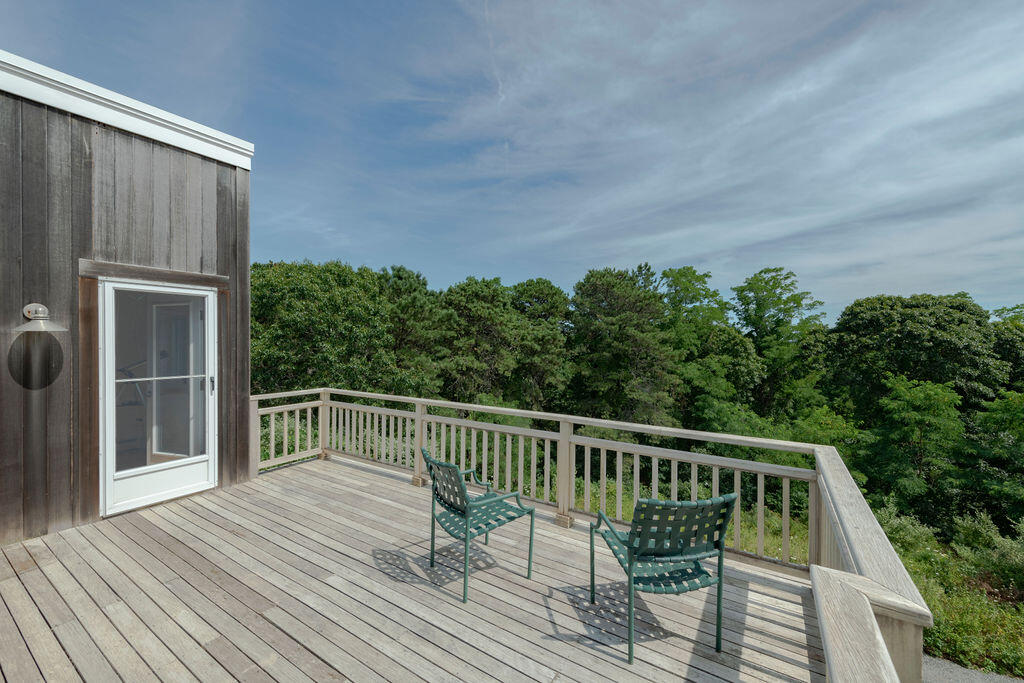 10 Hamblen Farm Road Wellfleet, MA 02667 - Photo 33 of 59 a balcony with wooden floor and outdoor seating