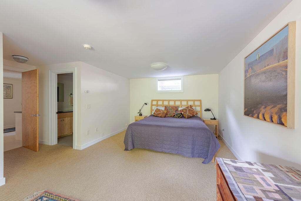 10 Hamblen Farm Road Wellfleet, MA 02667 - Photo 39 of 59 a bedroom with a bed and a painting on the wall