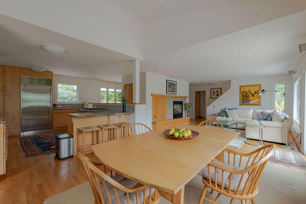 10 Hamblen Farm Road Wellfleet, MA 02667 - Photo 4 of 59 a large kitchen with a table and chairs
