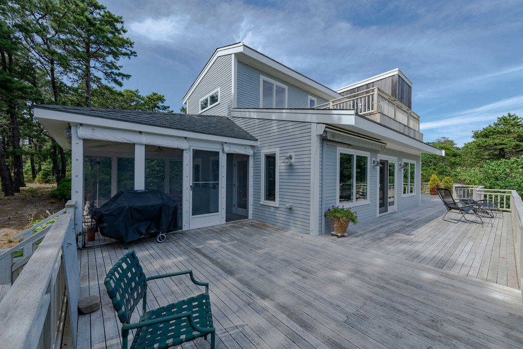 10 Hamblen Farm Road Wellfleet, MA 02667 - Photo 42 of 59 a view of a house with backyard and sitting area