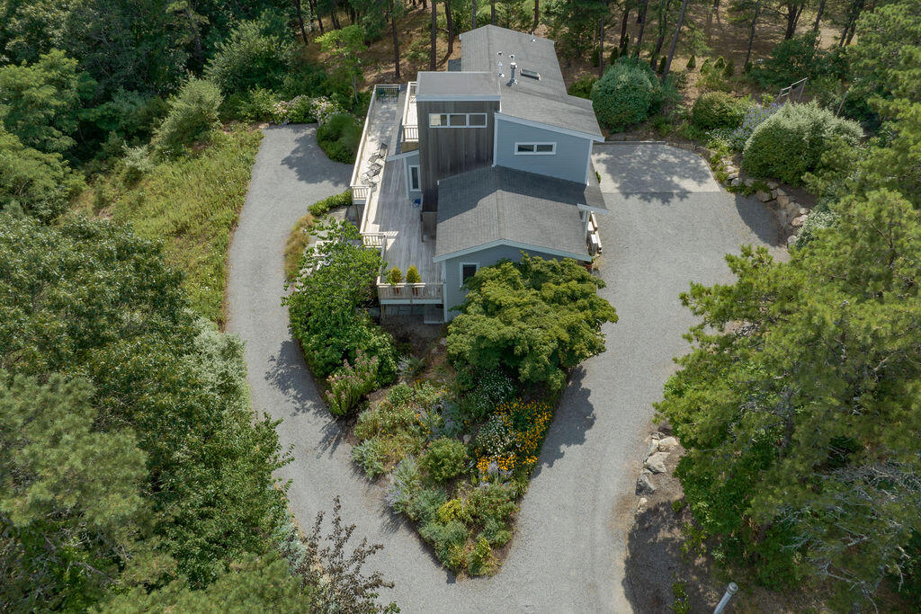 10 Hamblen Farm Road Wellfleet, MA 02667 - Photo 54 of 59 an aerial view of a house with a yard and trees all around